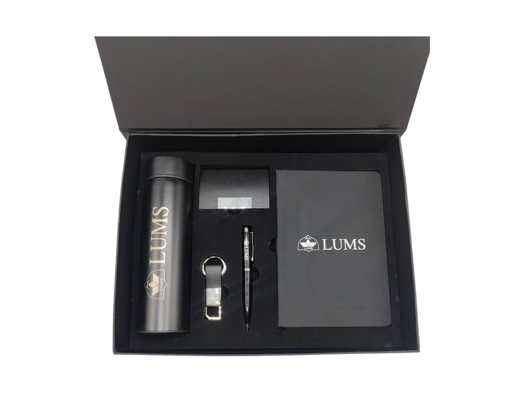 LUMS branded executive gift box featuring a black temperature display bottle, notebook, pen, and card holder.