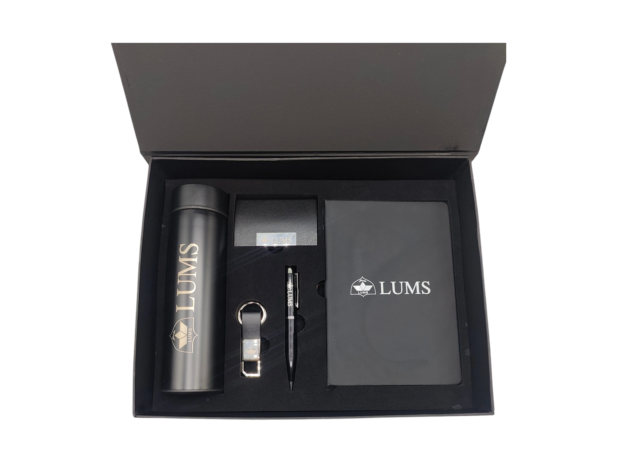 LUMS branded executive gift box featuring a black temperature display bottle, notebook, pen, and card holder.