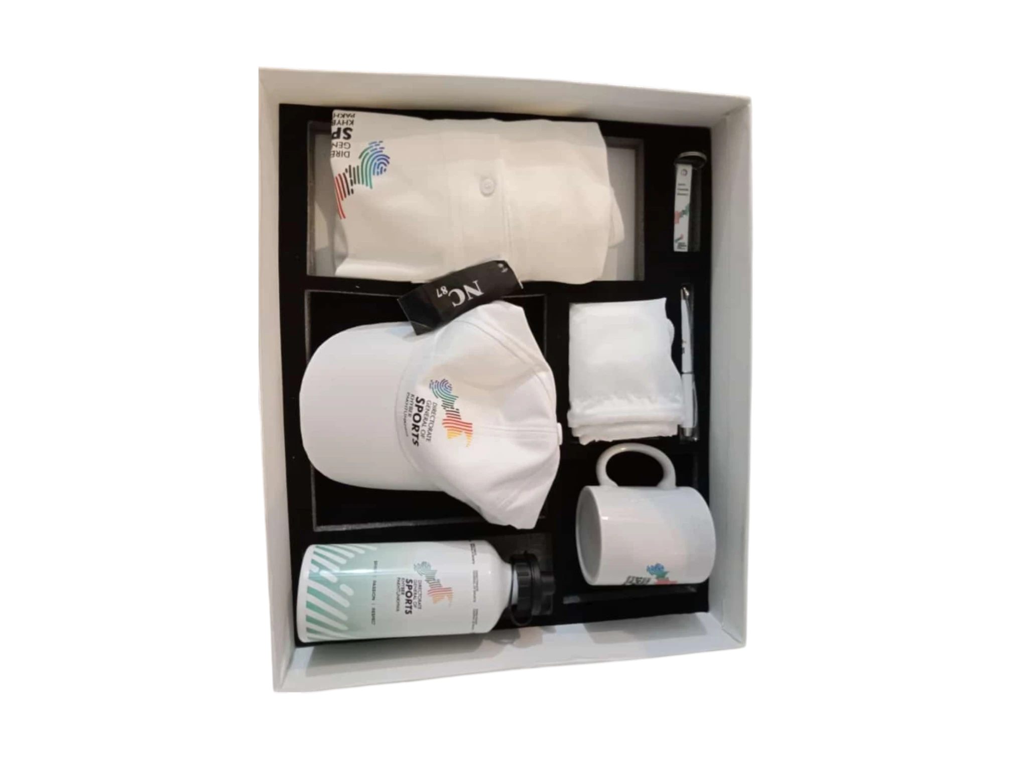 Sports-themed corporate kit featuring a branded polo shirt, cap, mug, water bottle, and accessories in a white gift box.