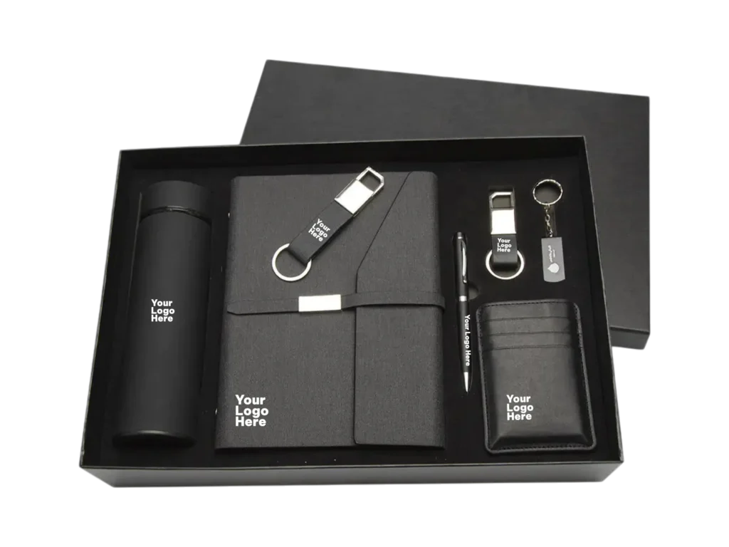 Premium 7-piece black corporate gift set with flask, notebook, keychains, pen, USB and card holder